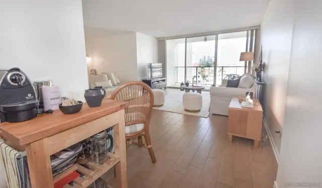 a bathroom with a granite countertop sink mirror vanity and toilet