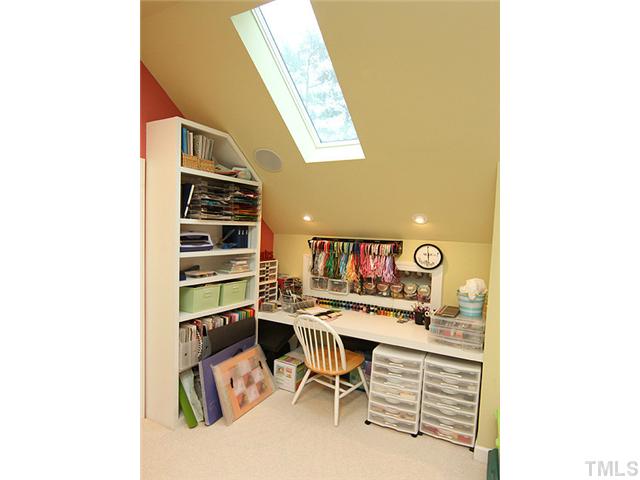 4019 Heathgate Lane Raleigh, NC 27613 - Photo 21 of 24 3rd floor flex room includes hobby center/wrapping station.