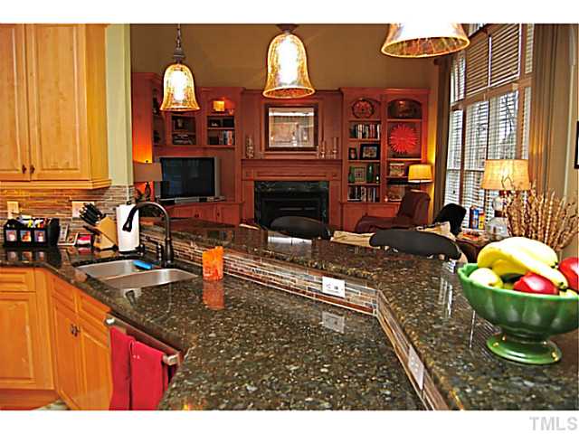 4019 Heathgate Lane Raleigh, NC 27613 - Photo 6 of 24 Granite counters, stone backsplash, maple cabinets.