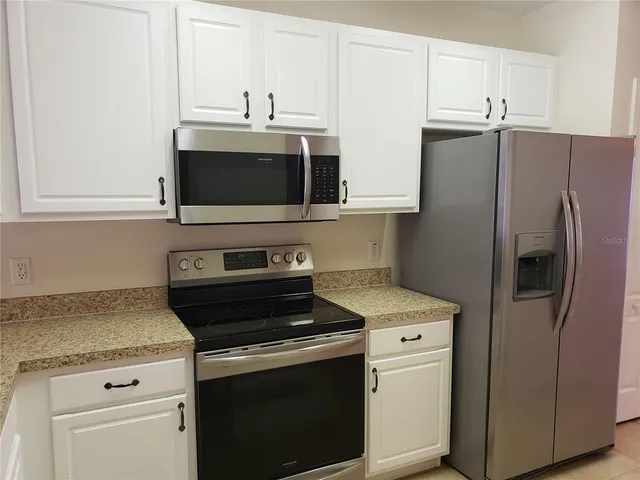 a very nice looking room with a kitchen