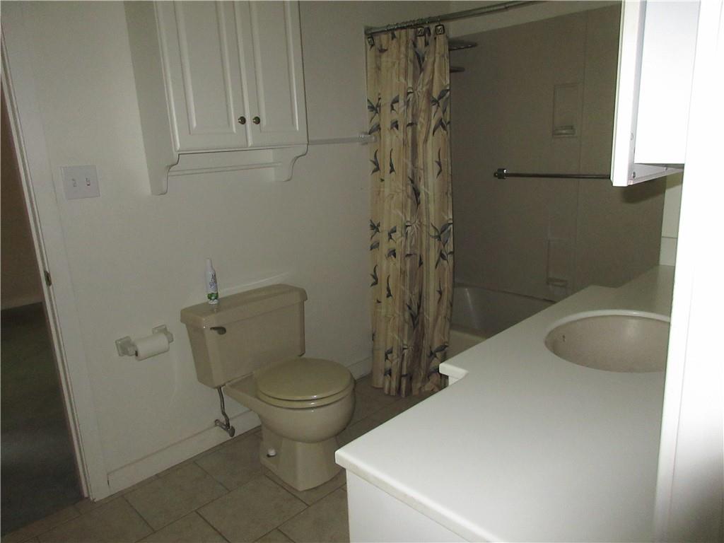 136 Hamel Road Renfrew, PA 16053 - Photo 13 of 18 a bathroom with a sink a toilet and shower