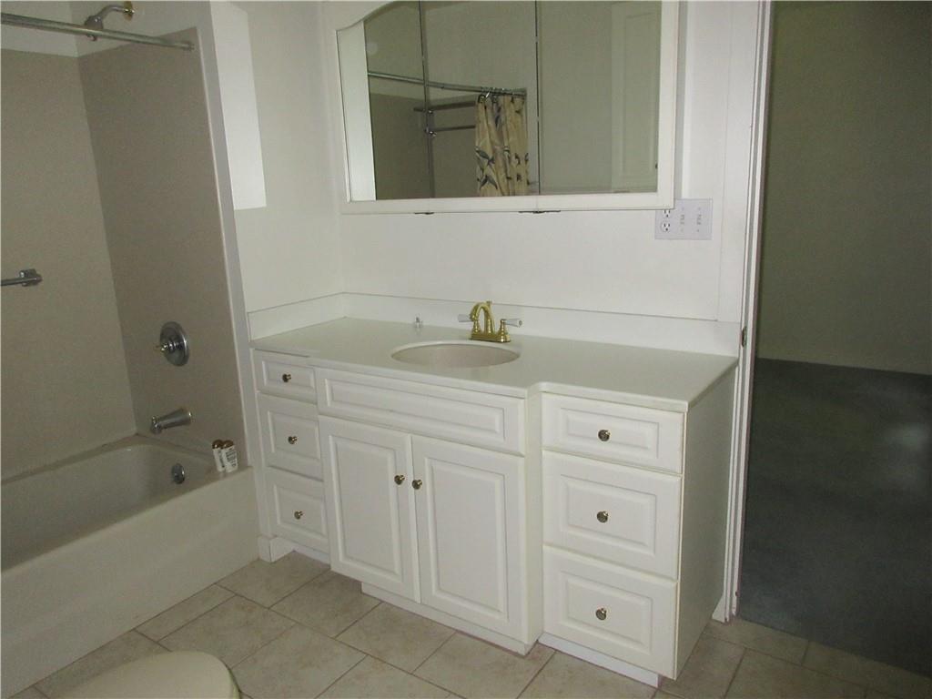 136 Hamel Road Renfrew, PA 16053 - Photo 14 of 18 a bathroom with a sink and a bathtub