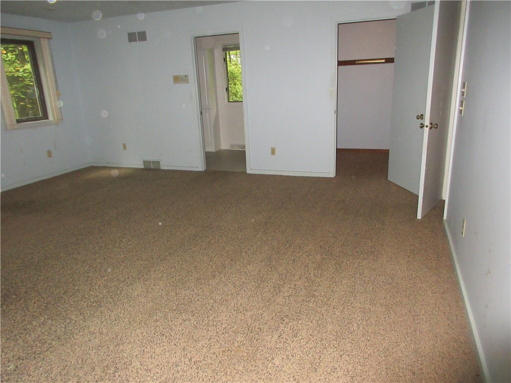 136 Hamel Road Renfrew, PA 16053 - Photo 9 of 18 an empty room with windows