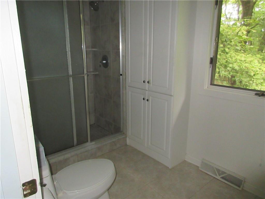 136 Hamel Road Renfrew, PA 16053 - Photo 10 of 18 a bathroom with a toilet and a shower