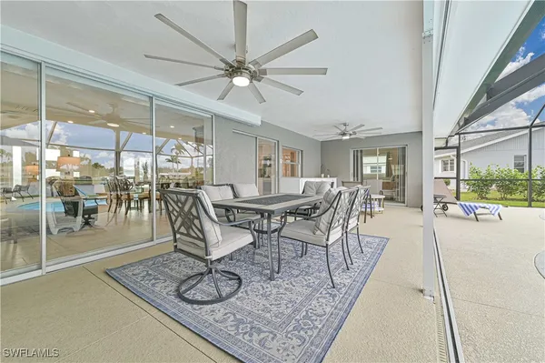 a kitchen with counter and view of living room