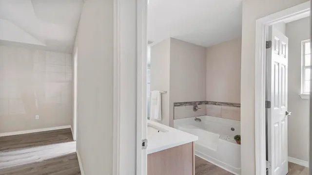 a bathroom with a bathtub and shower