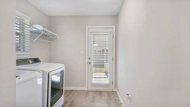 a view of a storage & utility room with a window