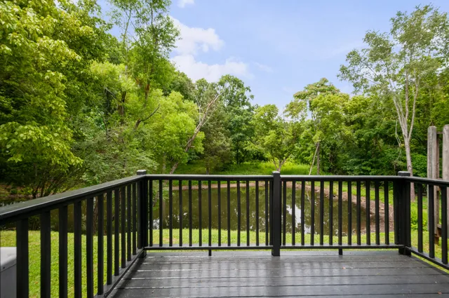 a view of balcony with wooden floor