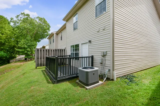 a view of a chair in backyard of house