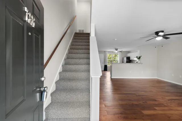 a view of an empty room and wooden floor