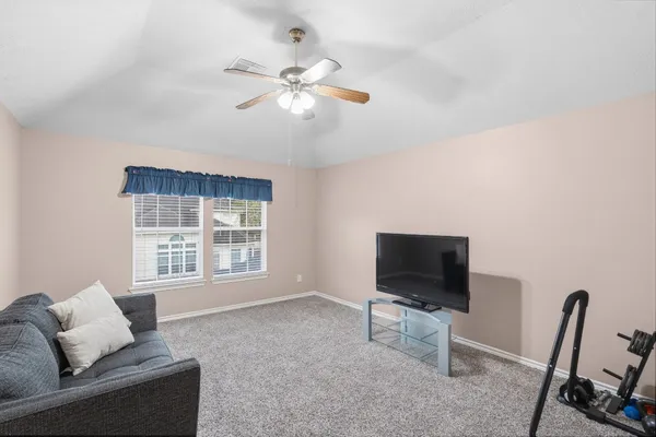 a view of balcony with furniture