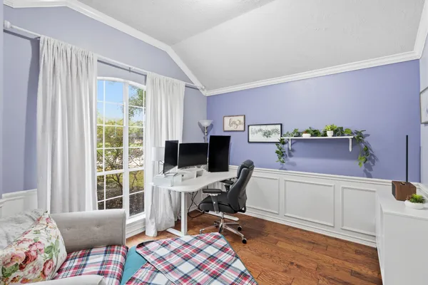 an empty room with wooden floor