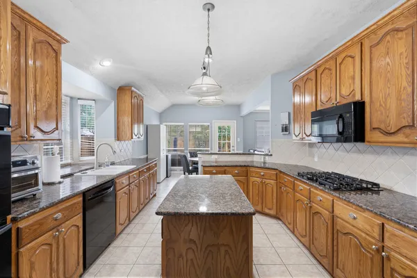 a bathroom with a sink a bathtub and a mirror