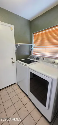 a kitchen with a stove a sink and a refrigerator