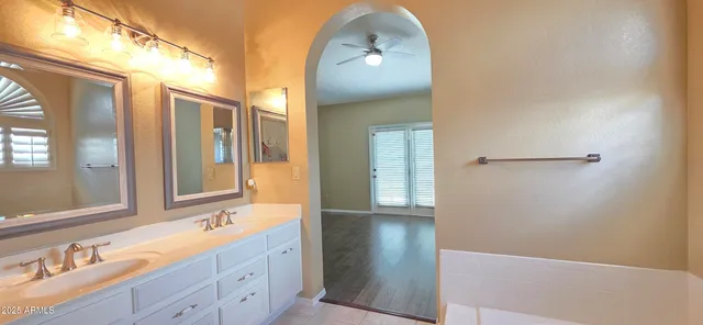 a view of a bathroom from a hallway
