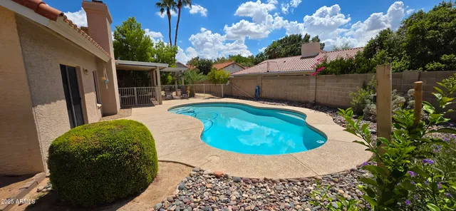an aerial view of a house with a swimming pool