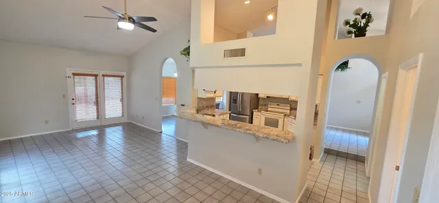 a view of kitchen with furniture and wooden floor
