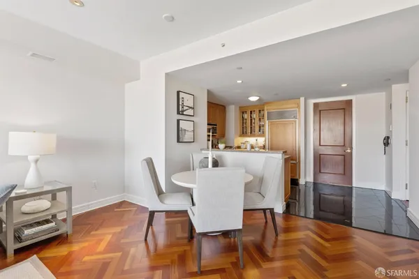 a view of a dining room with furniture and wooden floor