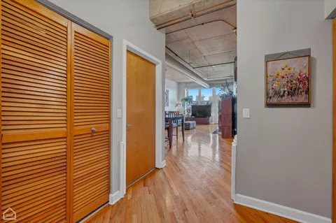 a view of a room with wooden floor