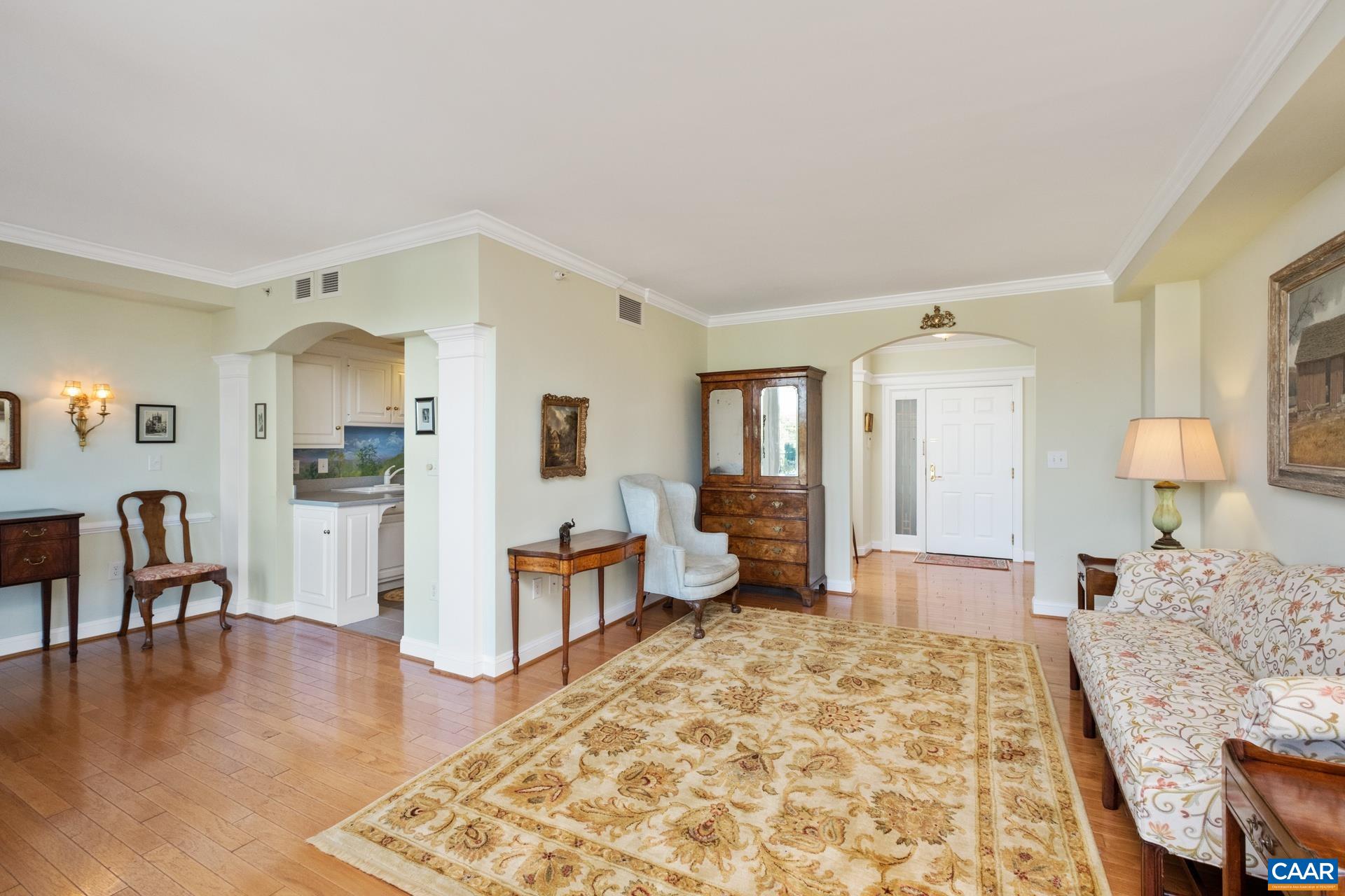 500 Crestwood Drive, Unit 1305 Charlottesville, VA 22903 - Photo 11 of 32 a bedroom with furniture and a wooden floor