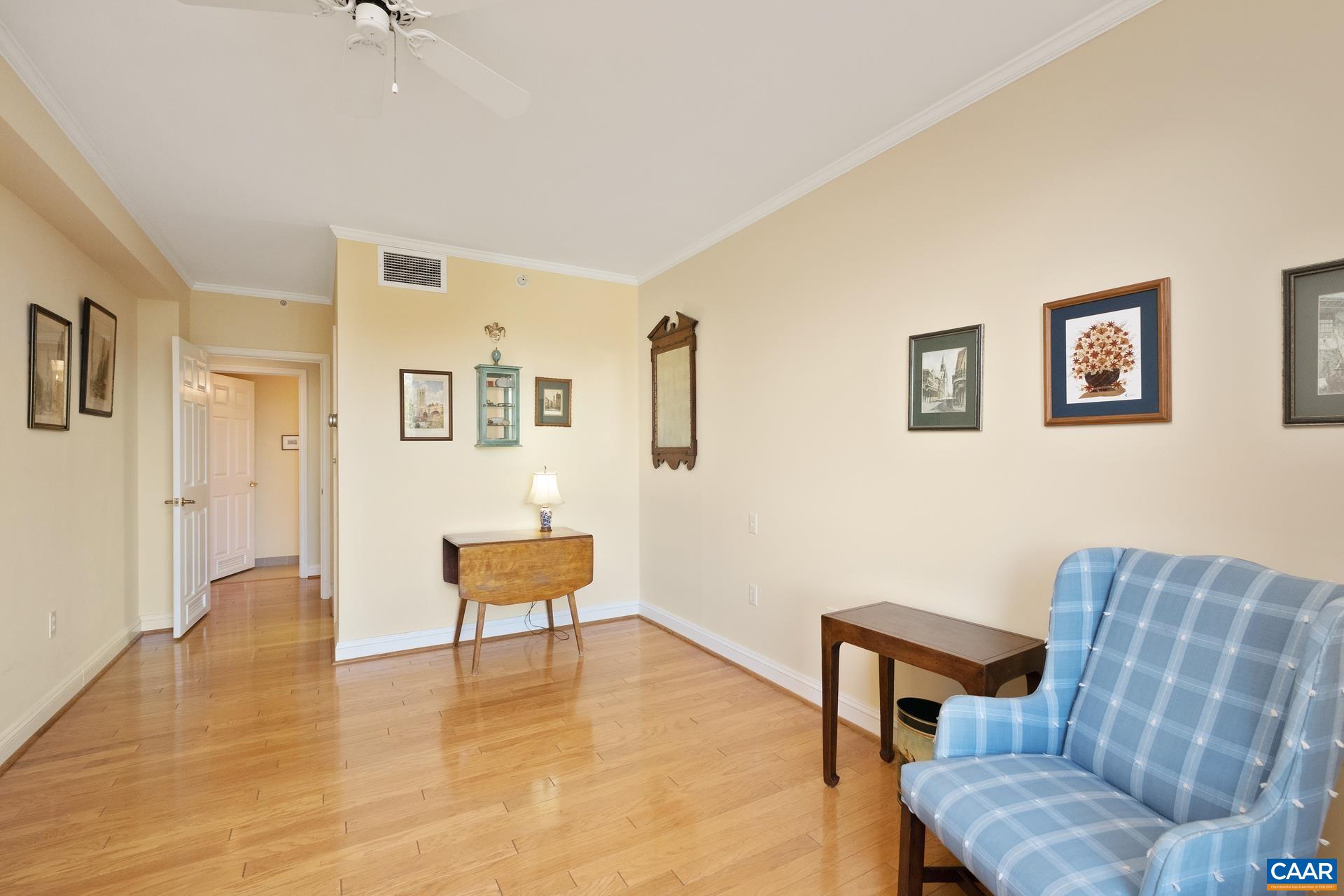 500 Crestwood Drive, Unit 1305 Charlottesville, VA 22903 - Photo 14 of 32 a living room with furniture and a chair