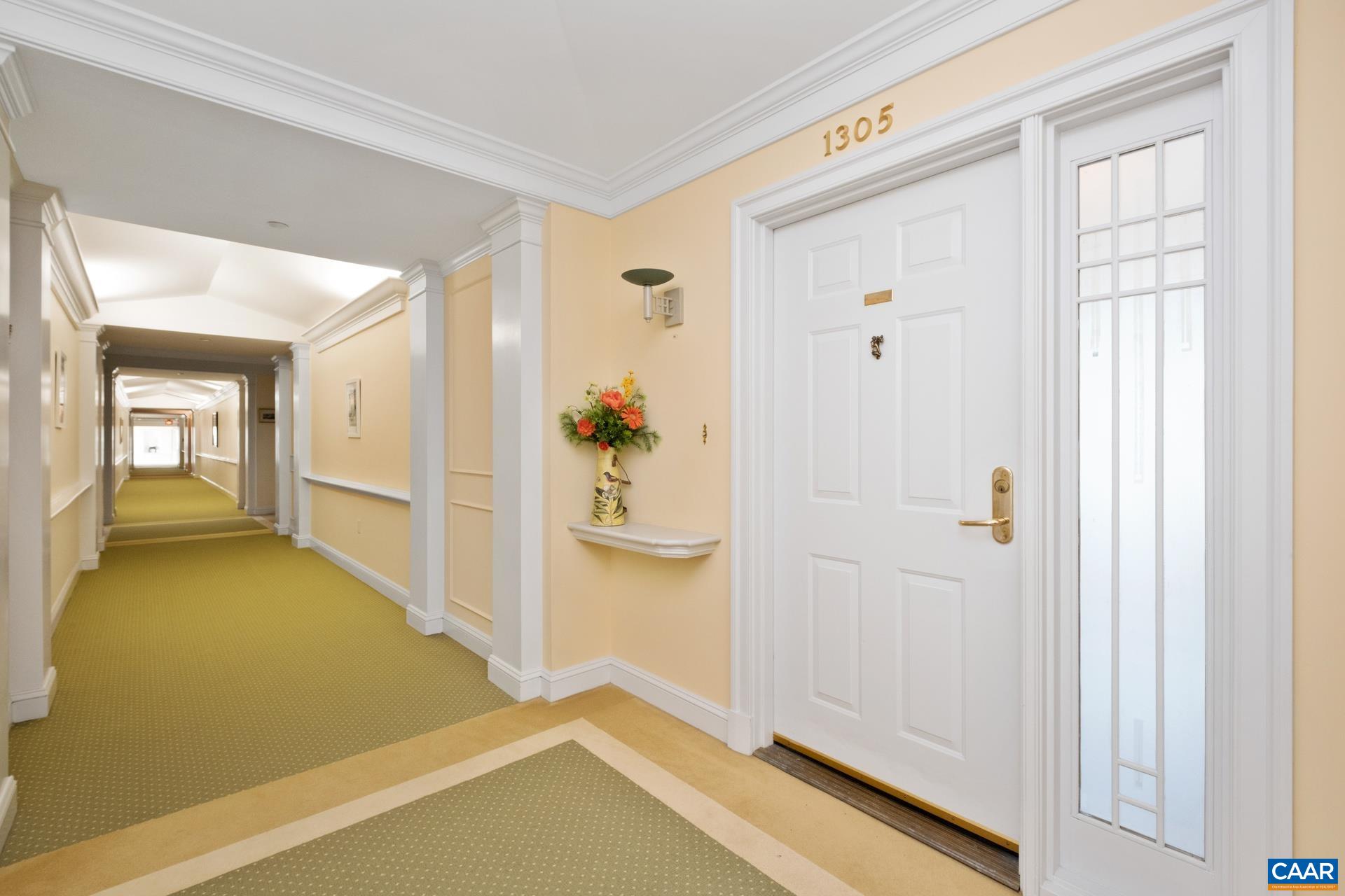 500 Crestwood Drive, Unit 1305 Charlottesville, VA 22903 - Photo 2 of 32 a view of a hallway with bathroom and mirror