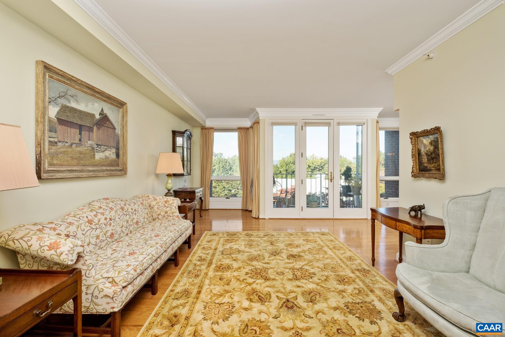 500 Crestwood Drive, Unit 1305 Charlottesville, VA 22903 - Photo 4 of 32 a bed room with a bed and a couch