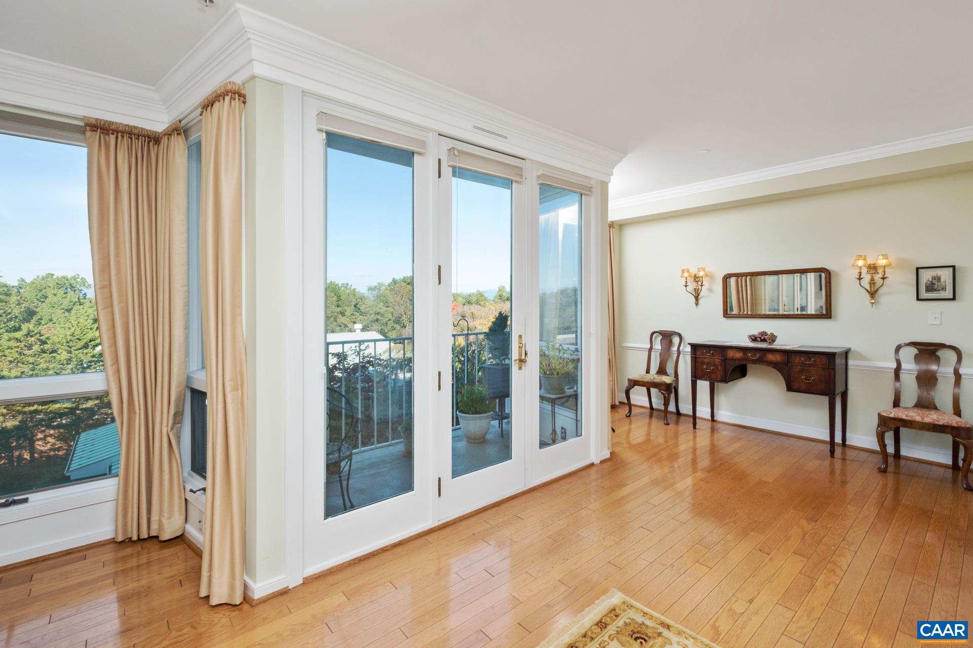 500 Crestwood Drive, Unit 1305 Charlottesville, VA 22903 - Photo 5 of 32 a view of a livingroom with furniture and a potted plant