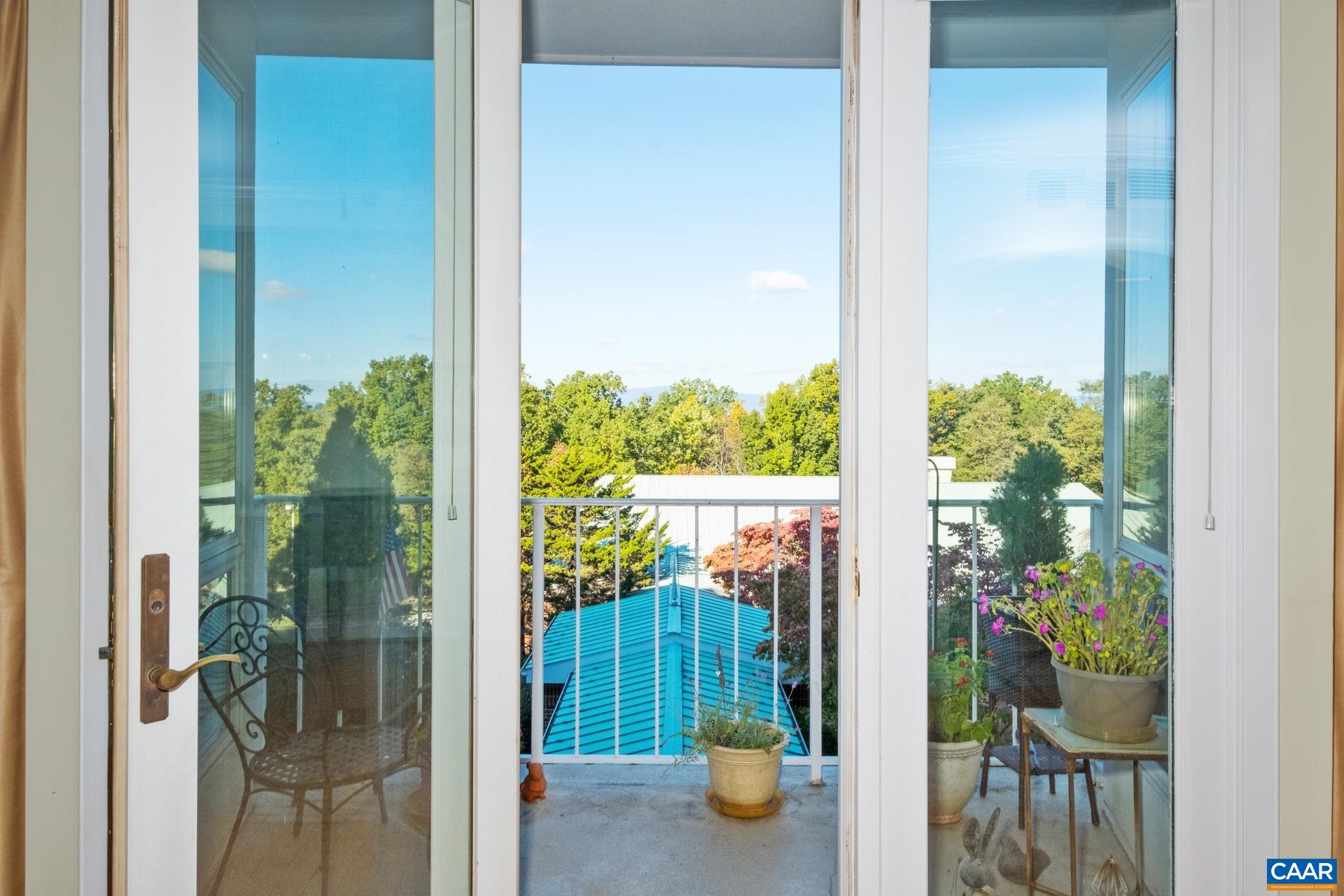 500 Crestwood Drive, Unit 1305 Charlottesville, VA 22903 - Photo 6 of 32 a view of a balcony with plants and garden