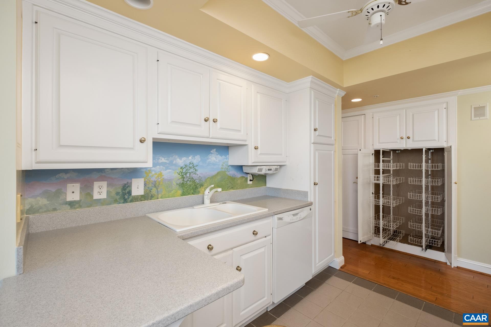 500 Crestwood Drive, Unit 1305 Charlottesville, VA 22903 - Photo 9 of 32 a kitchen with cabinets appliances and a sink