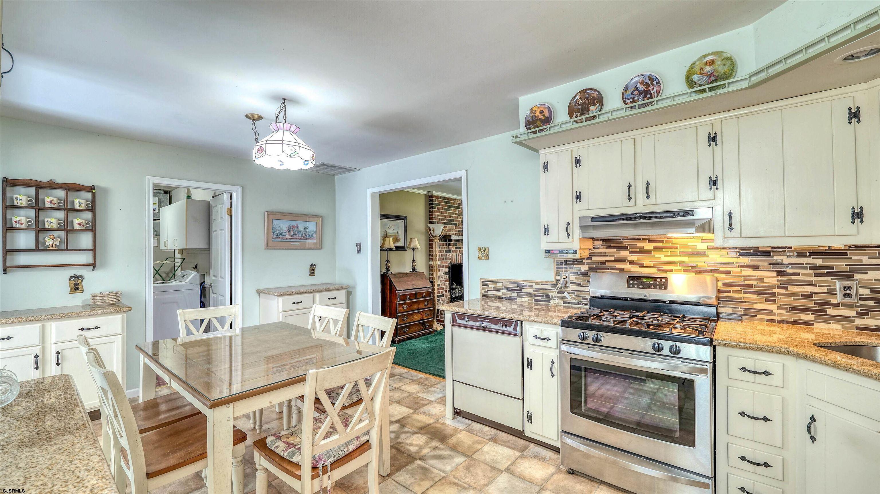 212 East Upland Avenue Galloway Township, NJ 08205 - Photo 13 of 37 a kitchen with a stove a sink and a refrigerator