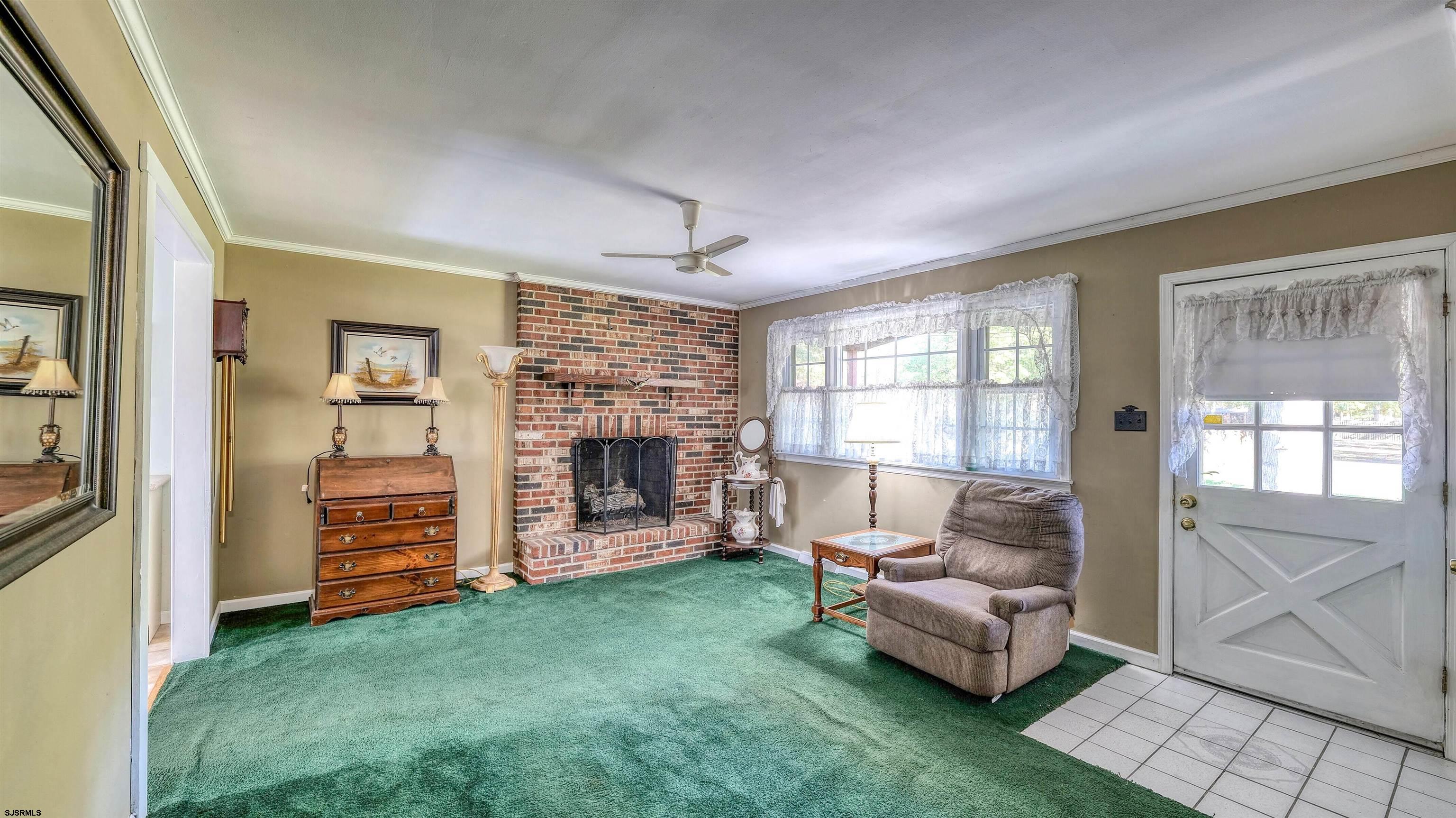 212 East Upland Avenue Galloway Township, NJ 08205 - Photo 14 of 37 a living room with furniture and a fireplace