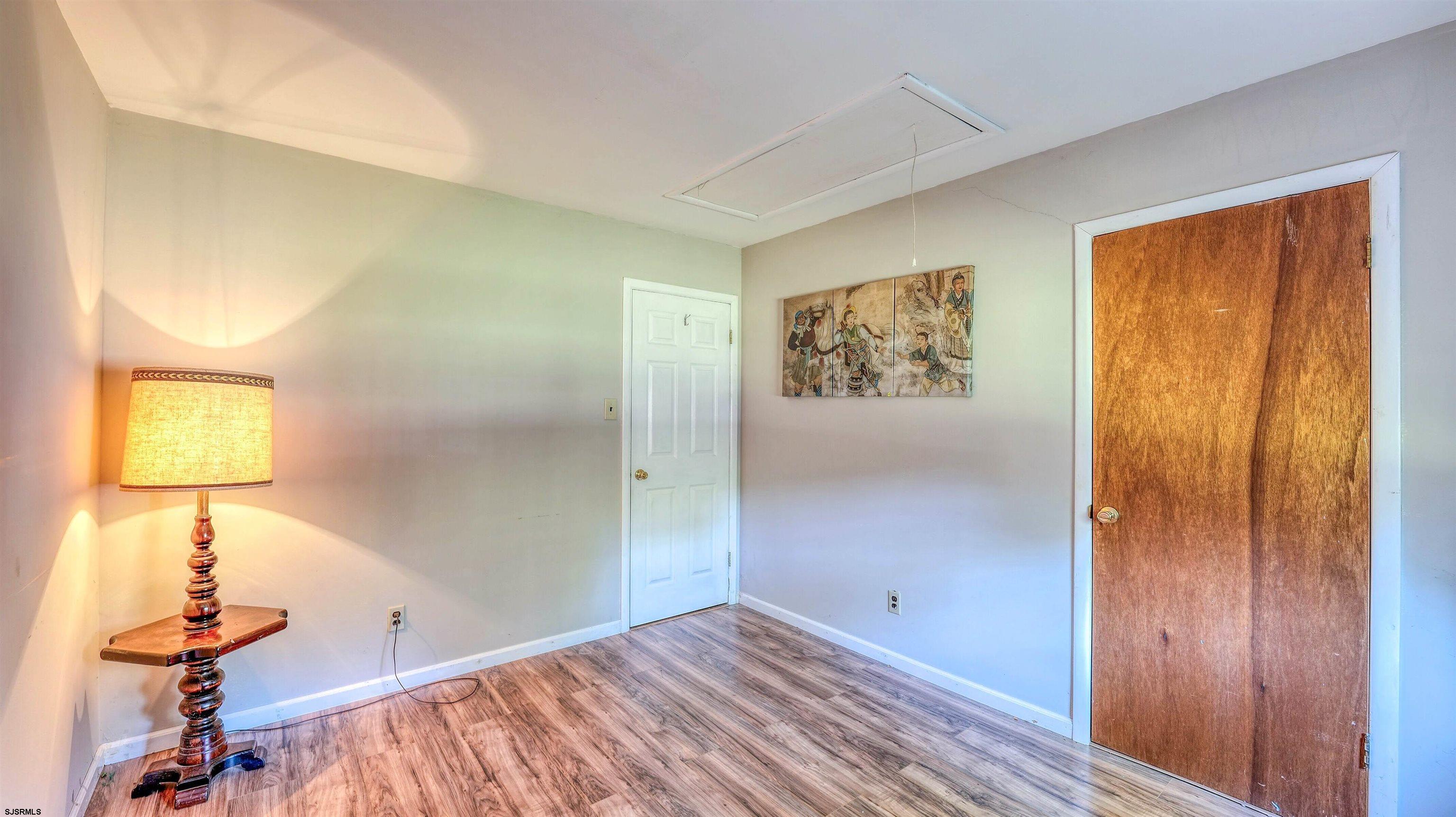 212 East Upland Avenue Galloway Township, NJ 08205 - Photo 16 of 37 a view of room with window and wooden floor