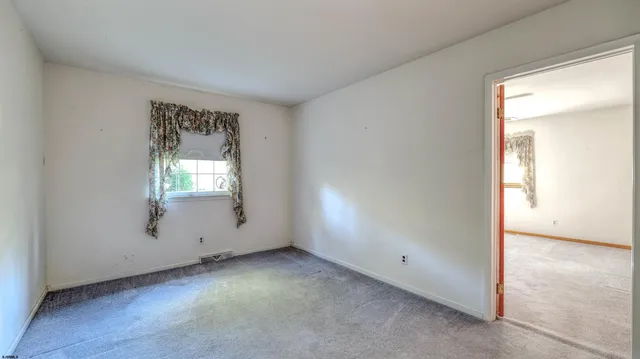 an empty room with window