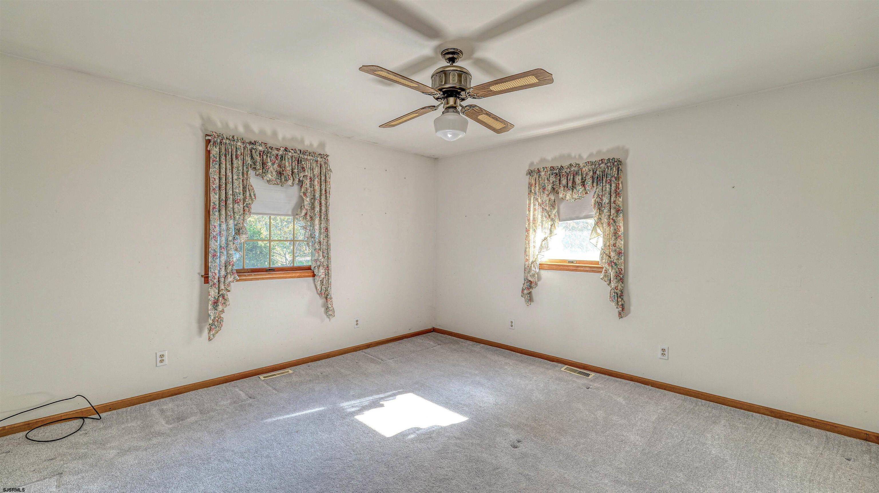212 East Upland Avenue Galloway Township, NJ 08205 - Photo 24 of 37 an empty room with windows and fan