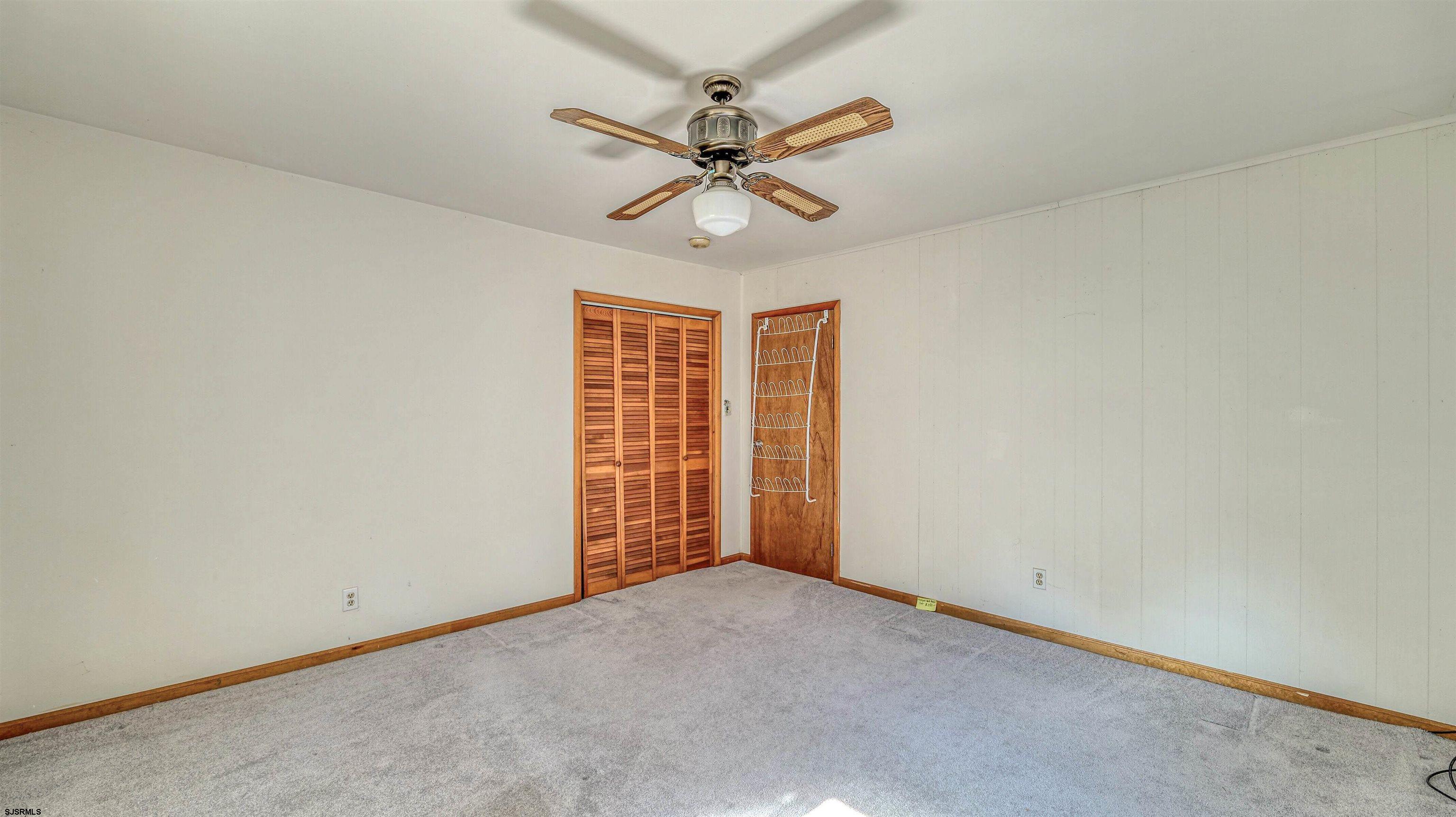 212 East Upland Avenue Galloway Township, NJ 08205 - Photo 25 of 37 an empty room with a ceiling fan and window