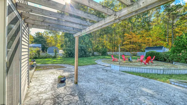 a view of yard with swimming pool