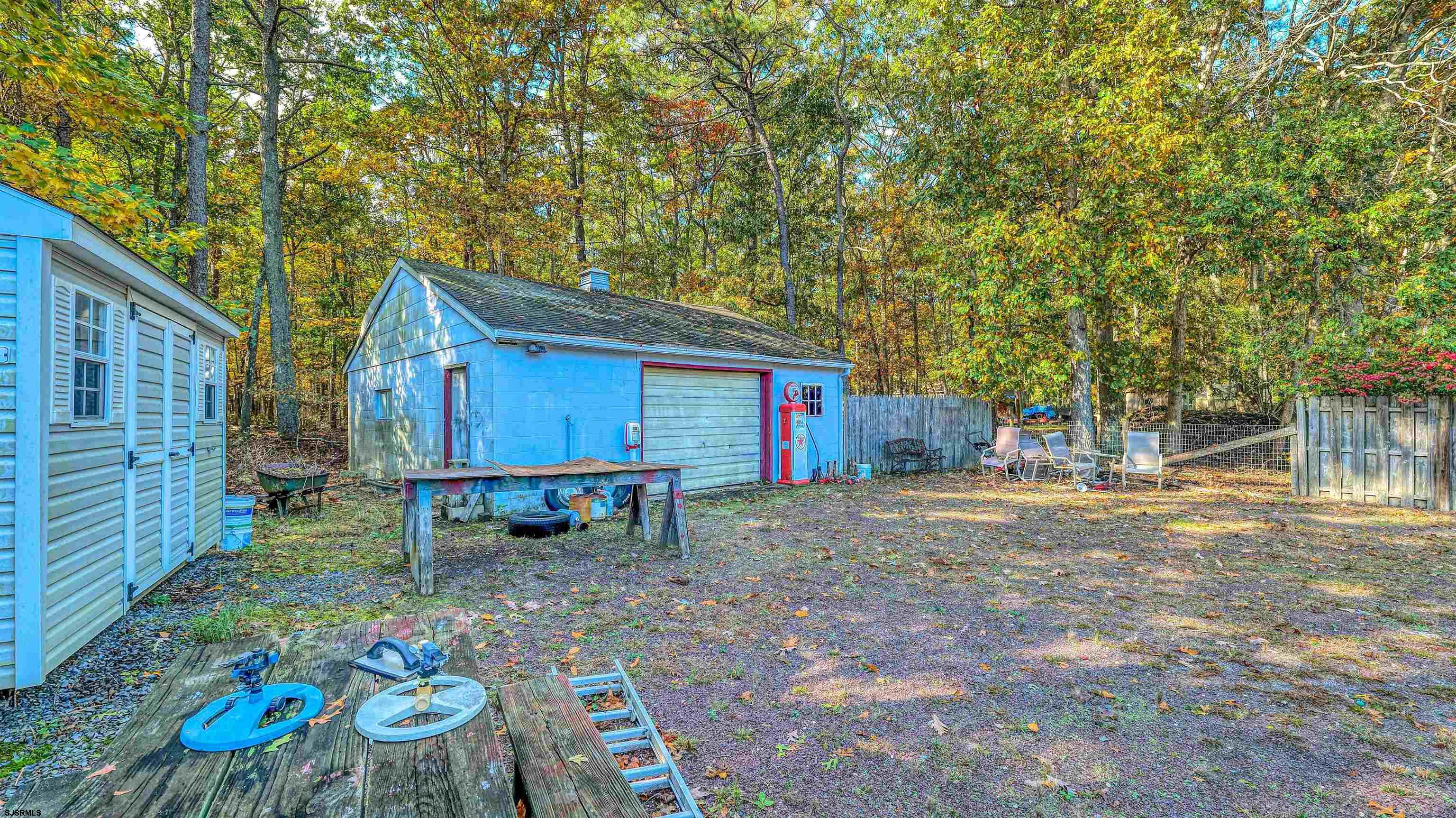 212 East Upland Avenue Galloway Township, NJ 08205 - Photo 34 of 37 a view of backyard with table and chairs and wooden fence