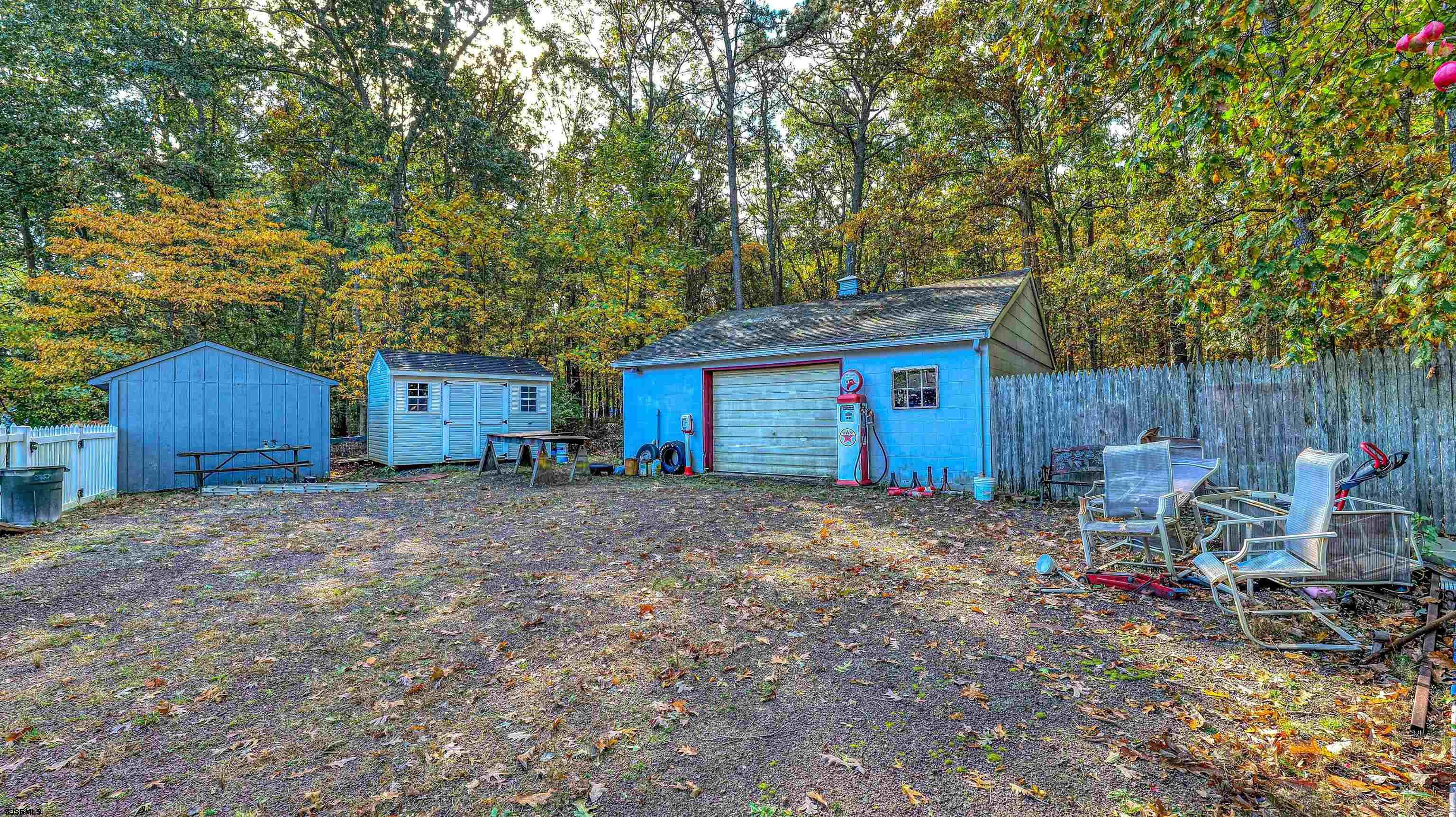212 East Upland Avenue Galloway Township, NJ 08205 - Photo 35 of 37 a view of a backyard with table and chairs and a large tree