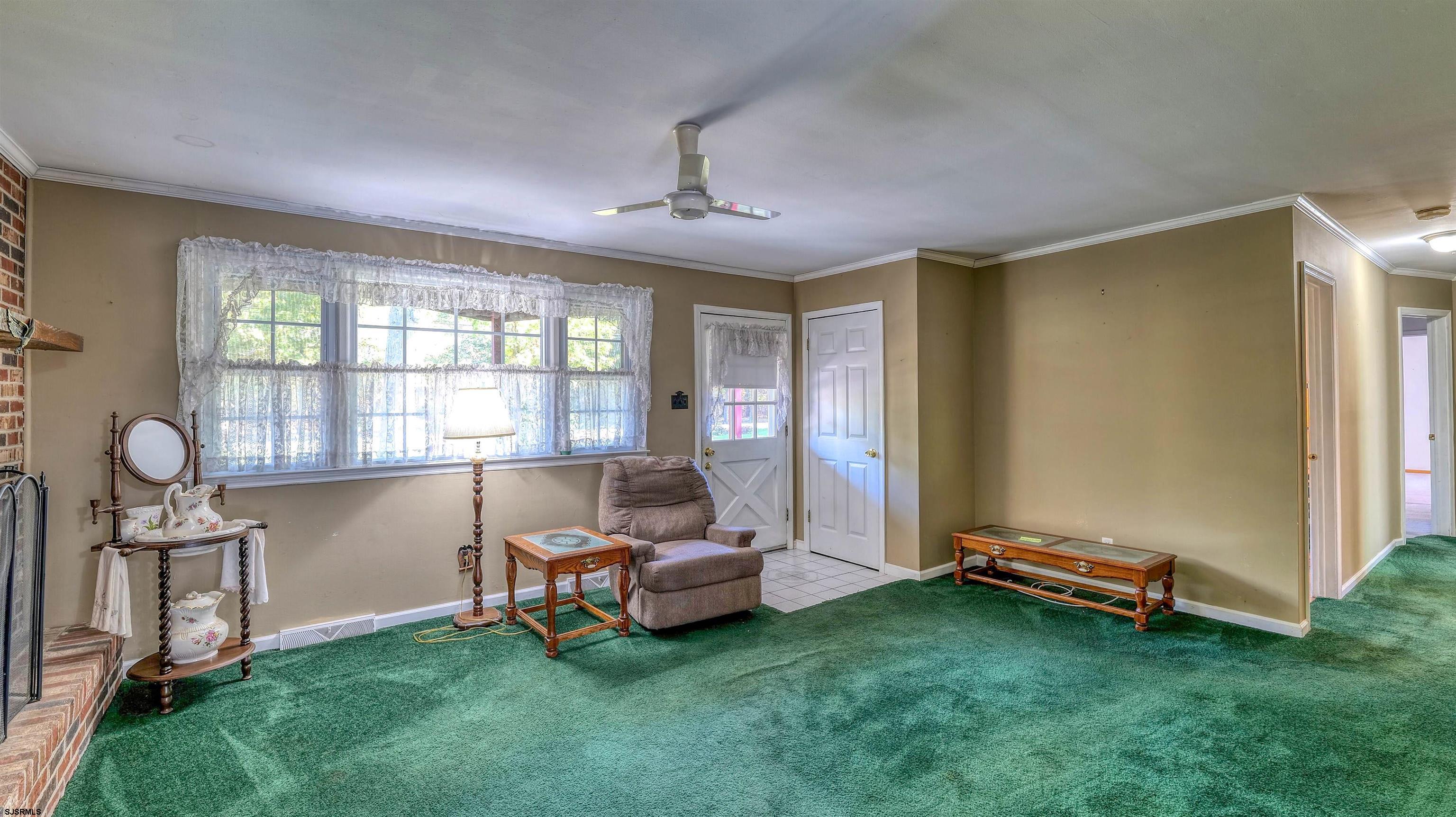 212 East Upland Avenue Galloway Township, NJ 08205 - Photo 7 of 37 a living room with furniture and a window