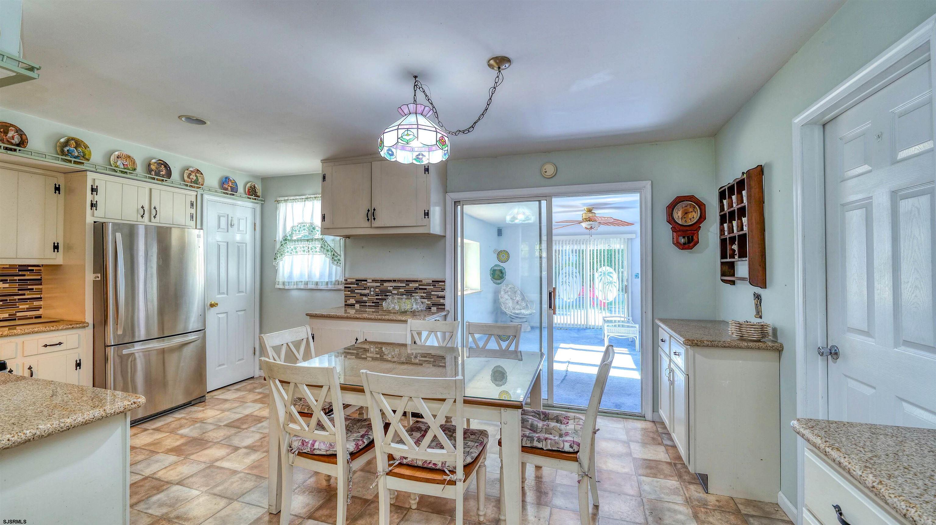 212 East Upland Avenue Galloway Township, NJ 08205 - Photo 8 of 37 a kitchen with stainless steel appliances a refrigerator and a stove top oven