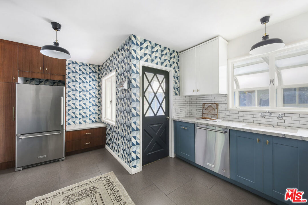 2145 Griffith Park Boulevard Los Angeles, CA 90039 - Photo 12 of 38 a kitchen with stainless steel appliances granite countertop a refrigerator and a sink
