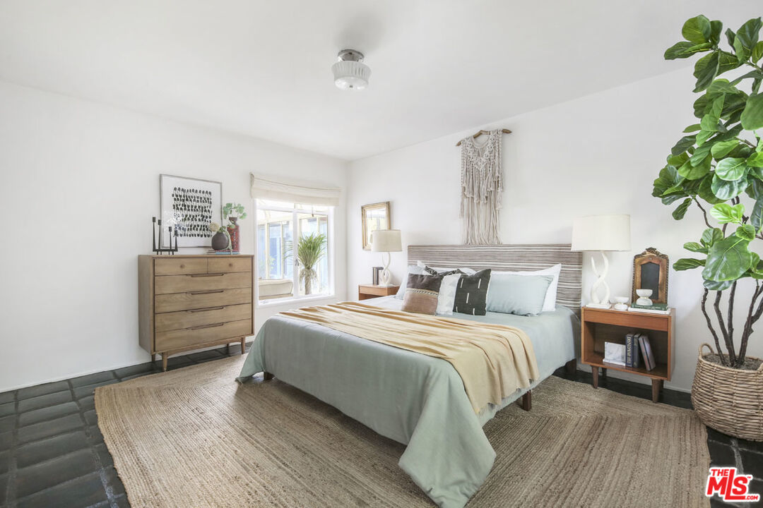 2145 Griffith Park Boulevard Los Angeles, CA 90039 - Photo 19 of 38 a bedroom with a bed and a potted plant on the dresser