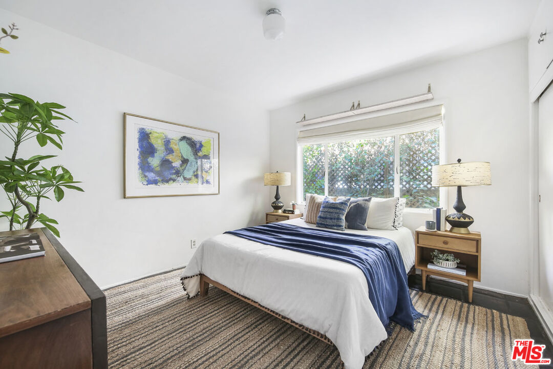 2145 Griffith Park Boulevard Los Angeles, CA 90039 - Photo 21 of 38 a bedroom with a bed and a potted plant on the dresser