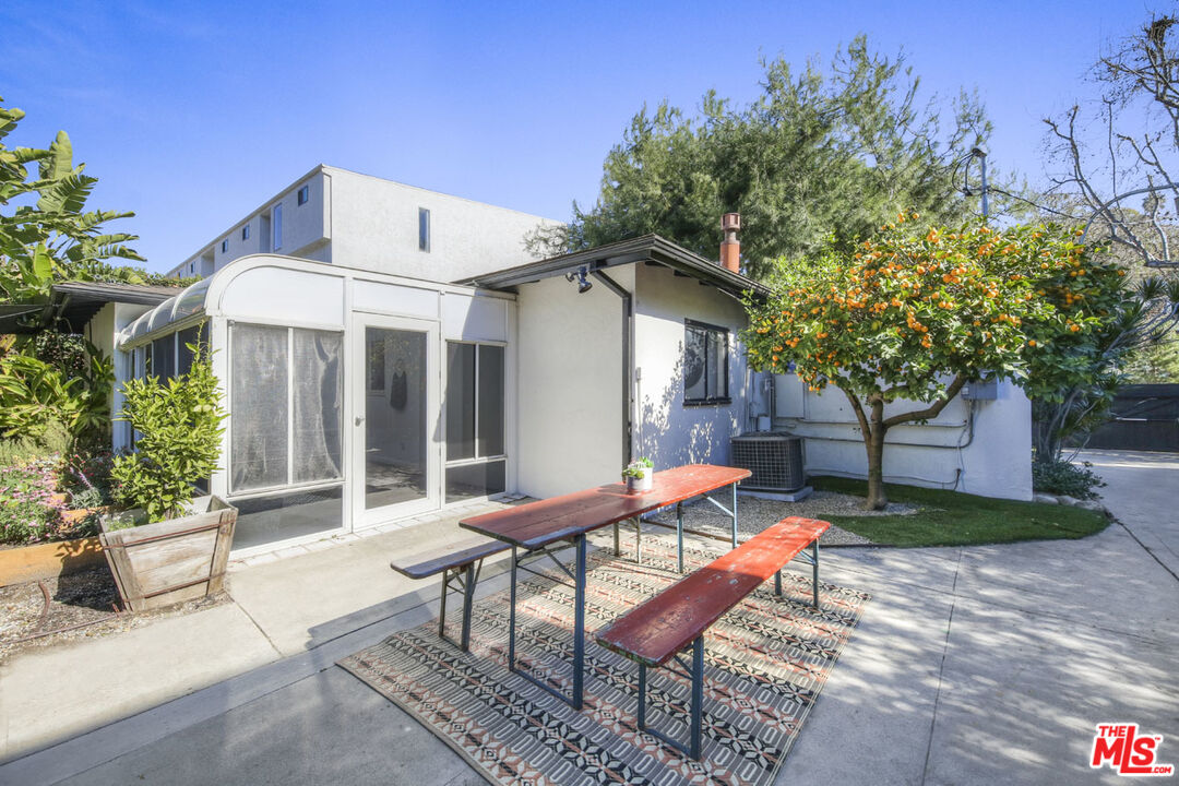 2145 Griffith Park Boulevard Los Angeles, CA 90039 - Photo 25 of 38 a view of a patio with table and chairs and potted plants