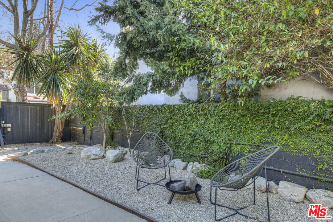 2145 Griffith Park Boulevard Los Angeles, CA 90039 - Photo 26 of 38 a backyard of a house with table and chairs