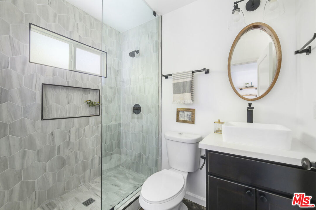 2145 Griffith Park Boulevard Los Angeles, CA 90039 - Photo 34 of 38 a bathroom with a sink a toilet and shower
