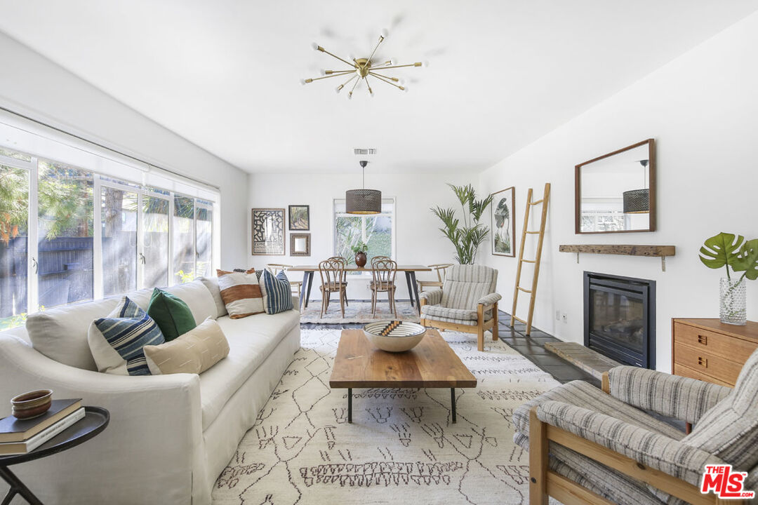 2145 Griffith Park Boulevard Los Angeles, CA 90039 - Photo 7 of 38 a living room with furniture fireplace and a large window