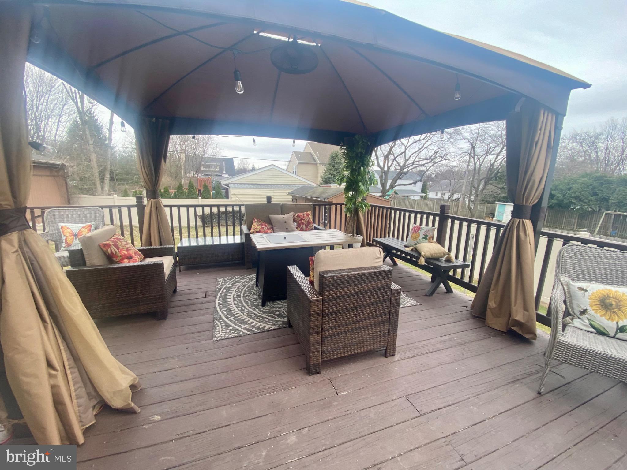 1755 Rockwell Road Abington, PA 19001 - Photo 17 of 19 a balcony with furniture and a wooden floor