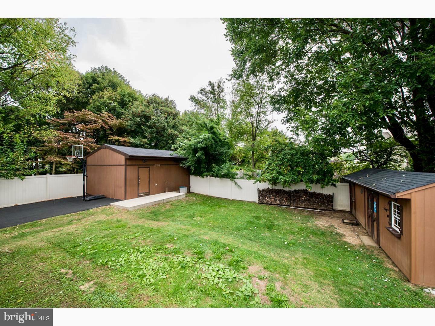1755 Rockwell Road Abington, PA 19001 - Photo 18 of 19 a view of a backyard with a garden and trees